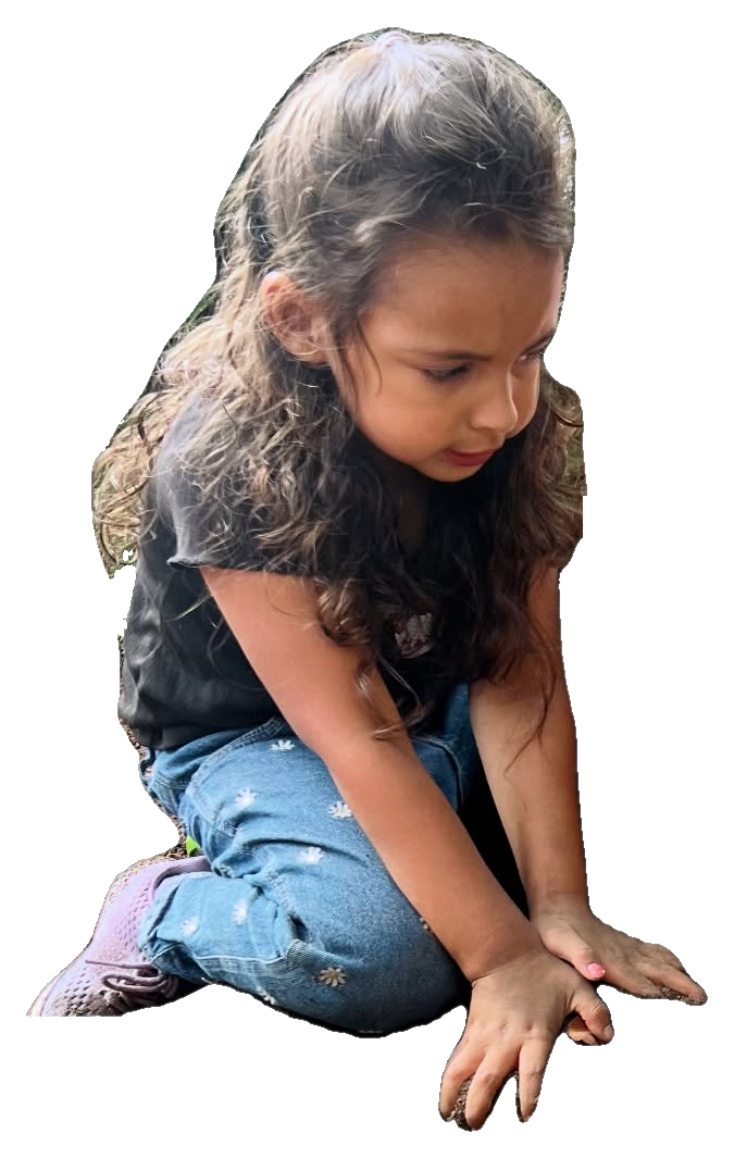 Child playing and exploring outdoors at Rita's Kids Daycare