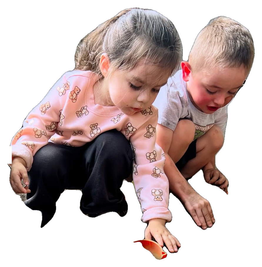 Children playing and exploring outdoors at Rita's Kids Daycare